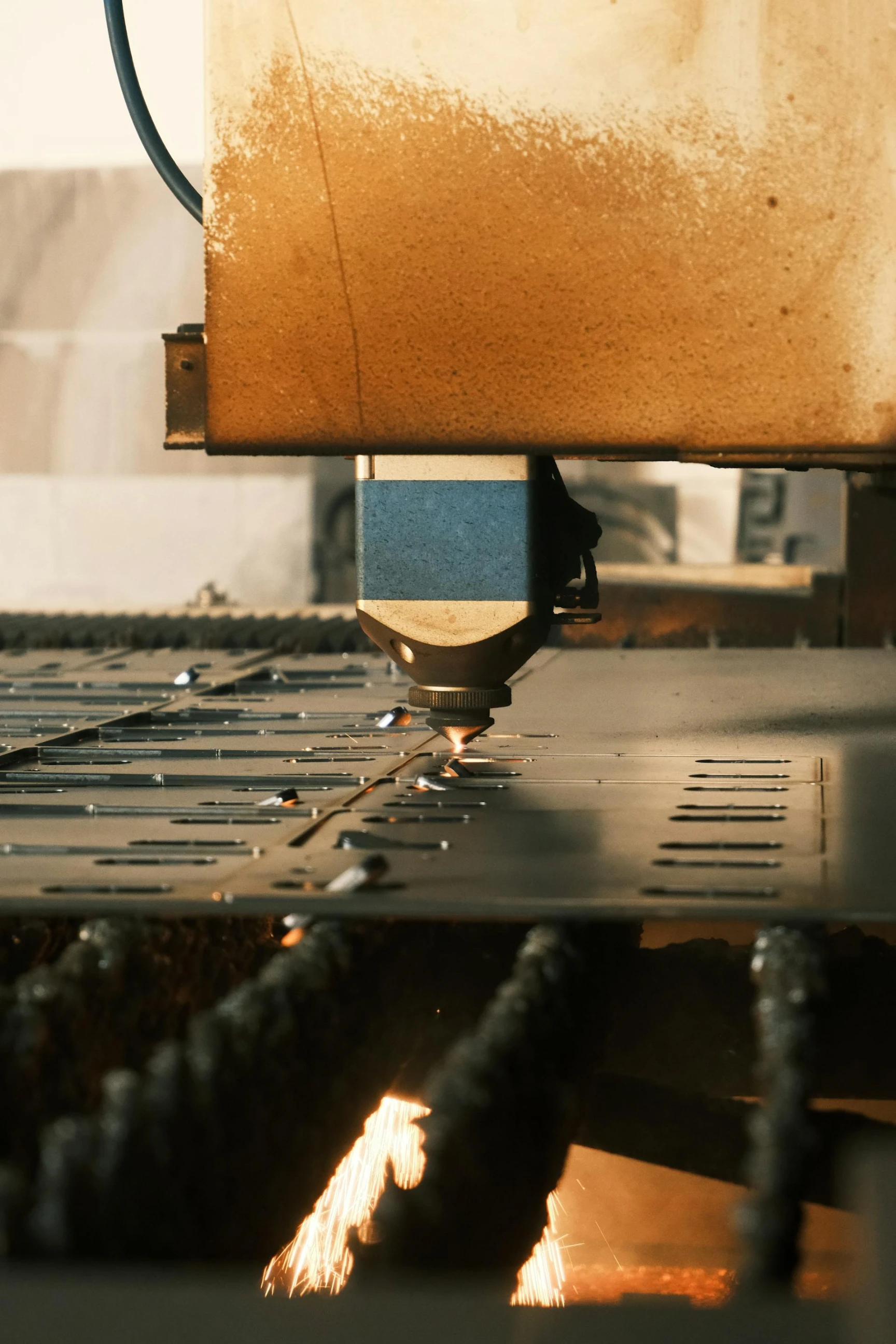 Laser cutting steel in a manufacturing facility